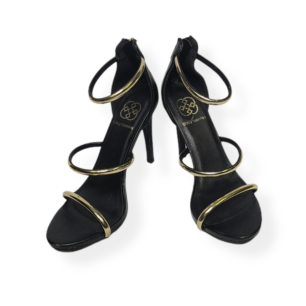 Women's black and gold strappy heels